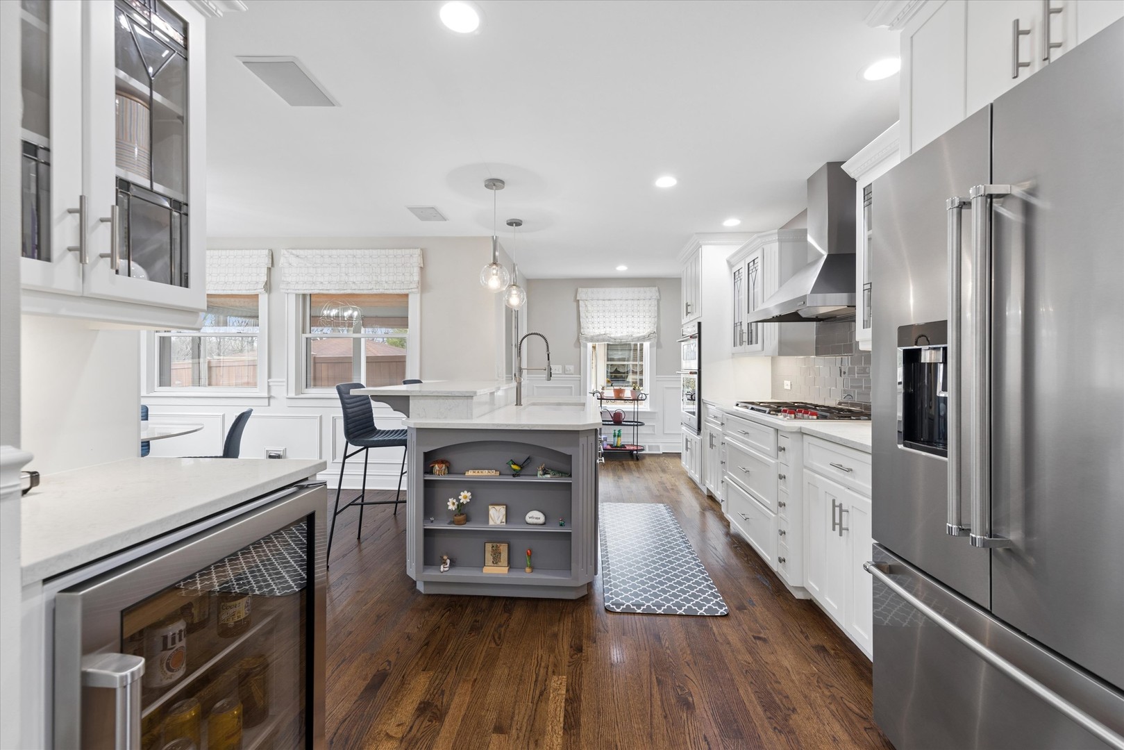 346 South Street Elmhurst, IL 60126 - Photo 11 of 43 a kitchen with stainless steel appliances granite countertop a refrigerator a stove and a wooden floors