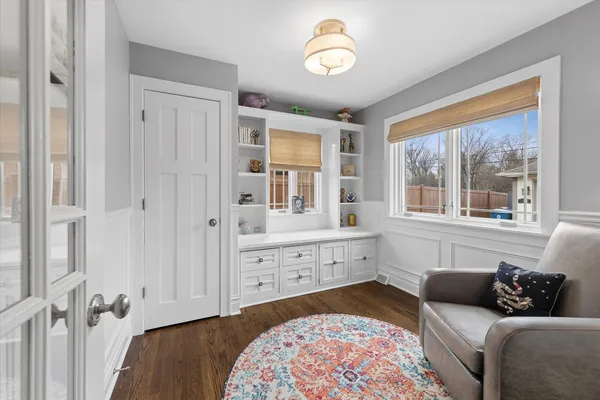 a spacious bedroom with a bed and a window