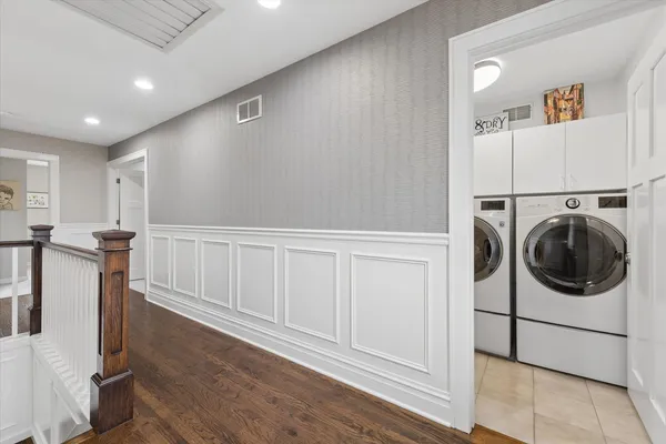 a view of a kitchen with washer and dryer