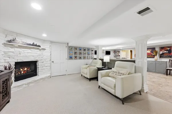 a living room with furniture and a fireplace