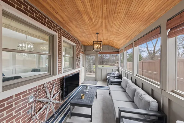 a lobby with furniture and large windows