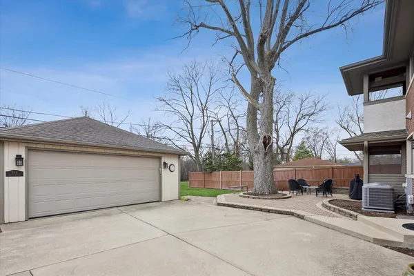 a view of a house with a yard and garage