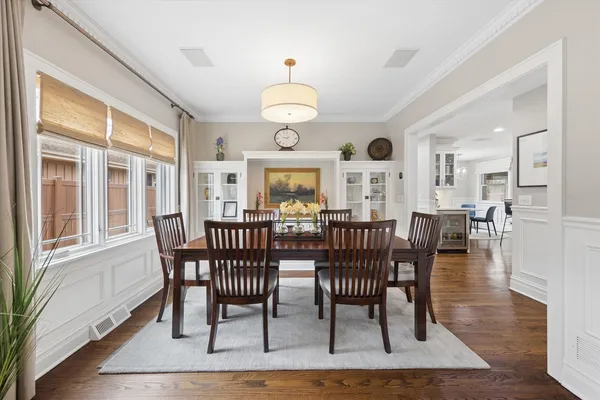 a view of a dining room with furniture window and wooden floor