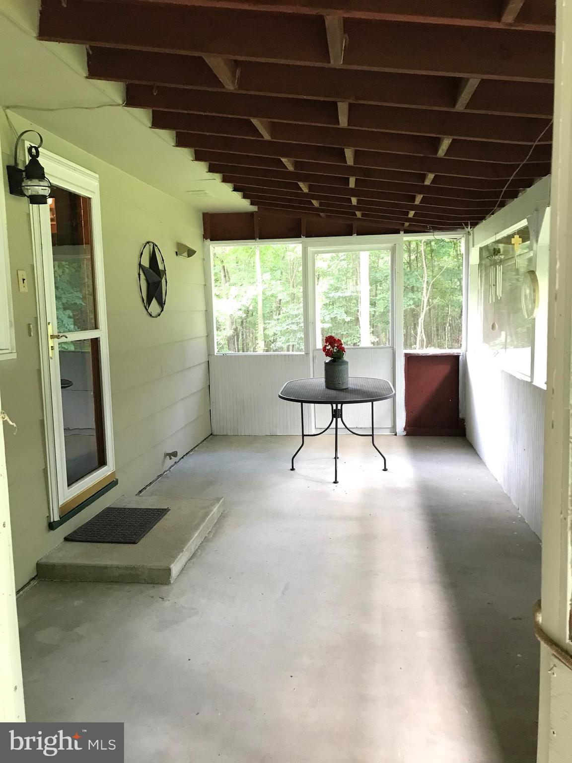 23701 Rocky Ridge Road Rawlings, MD 21557 - Photo 14 of 55 Screened porch off of kitchen!