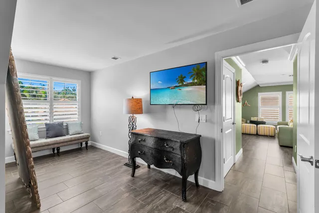 a living room with furniture fireplace and flat screen tv