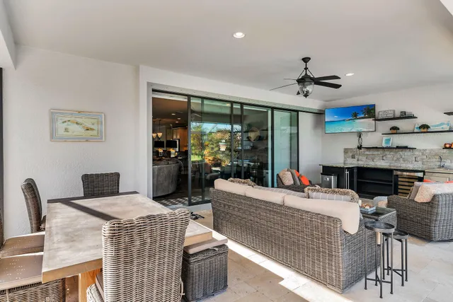 a front view of a house with a garden and plants