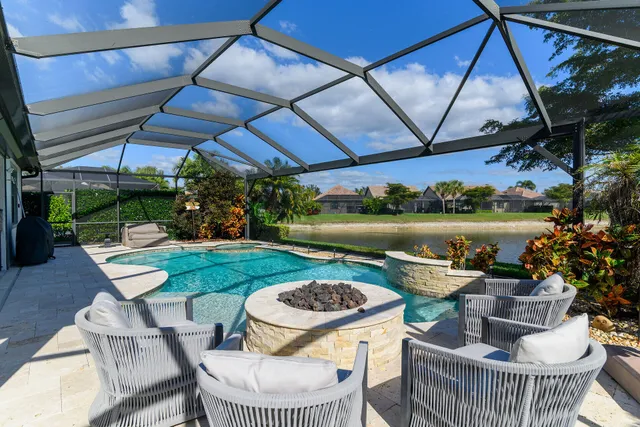 an aerial view of a house with a lake view