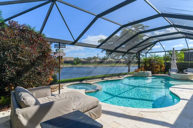 an aerial view of residential houses with outdoor space and swimming pool