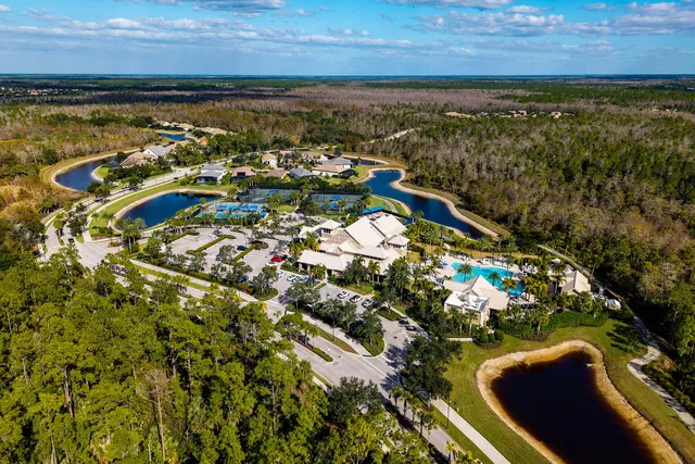 a view of swimming pool with outdoor seating and garden