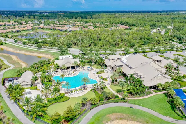 a view of house with outdoor space and swimming pool