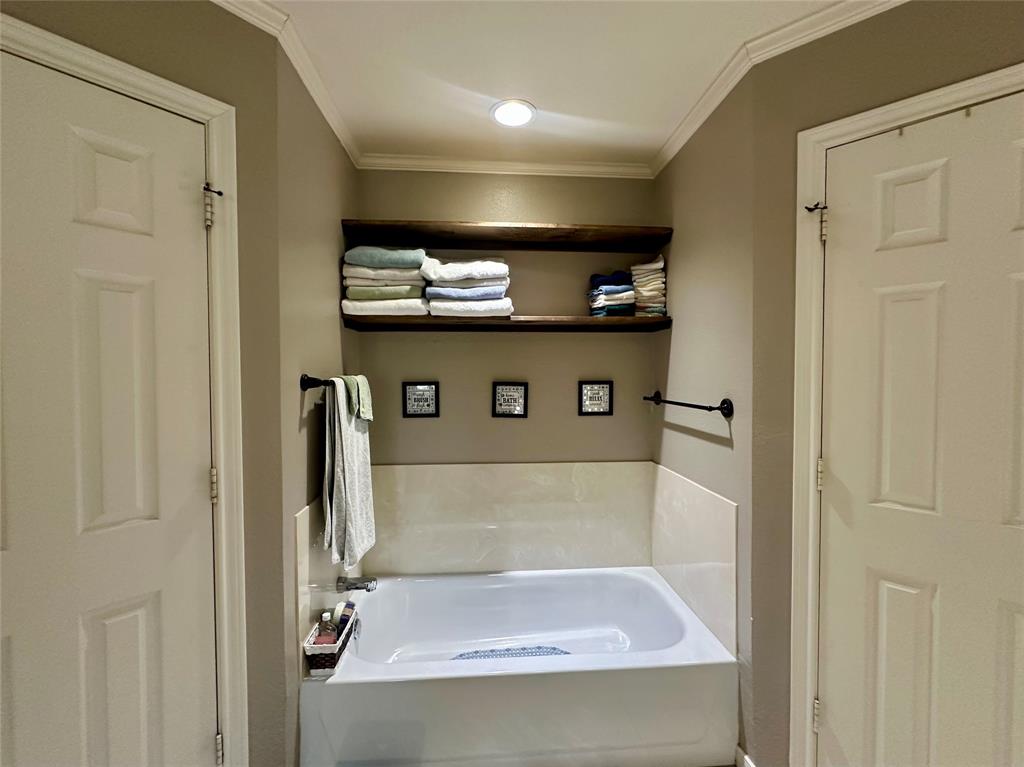 10504 Whitney Trace Drive Waco, TX 76708 - Photo 18 of 36 a view of a bathroom with a sink and a mirror