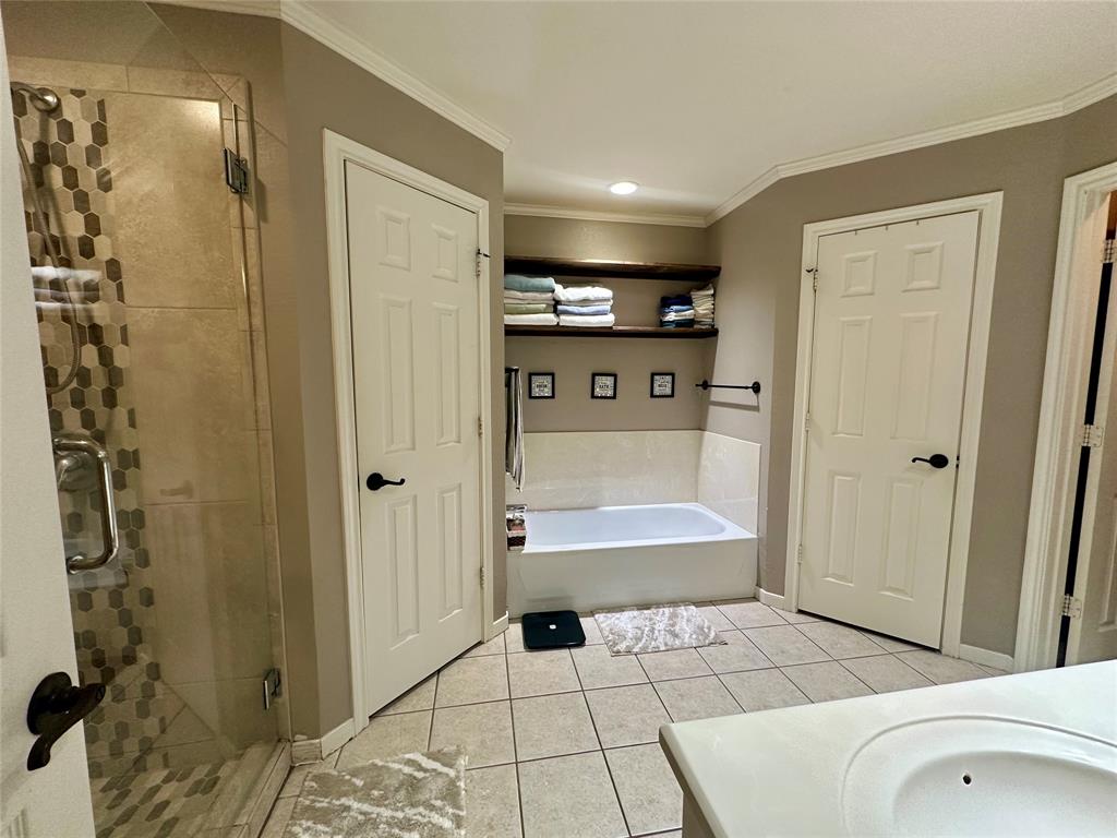 10504 Whitney Trace Drive Waco, TX 76708 - Photo 21 of 36 a bathroom with a sink toilet and shower