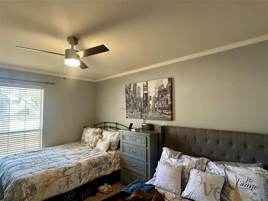 10504 Whitney Trace Drive Waco, TX 76708 - Photo 22 of 36 a bedroom with bed and window