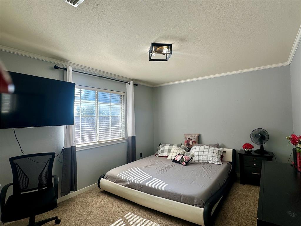 10504 Whitney Trace Drive Waco, TX 76708 - Photo 27 of 36 a bedroom with a bed and a window