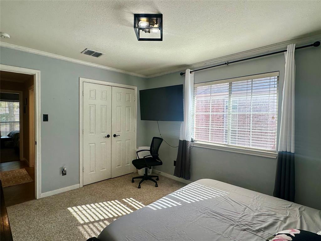 10504 Whitney Trace Drive Waco, TX 76708 - Photo 28 of 36 a bedroom with a bed and a window
