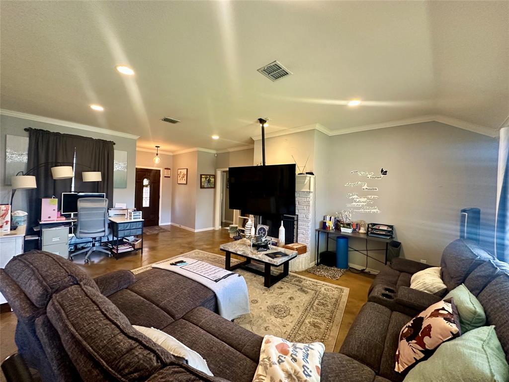 10504 Whitney Trace Drive Waco, TX 76708 - Photo 3 of 36 a living room with furniture and a flat screen tv