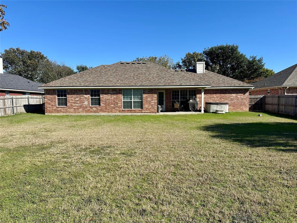 10504 Whitney Trace Drive Waco, TX 76708 - Photo 31 of 36 front view of a house with a yard
