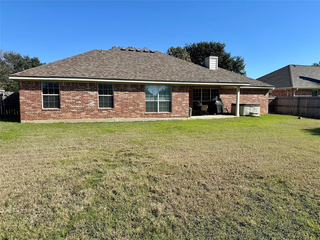 10504 Whitney Trace Drive Waco, TX 76708 - Photo 32 of 36 a front view of a house with a garden