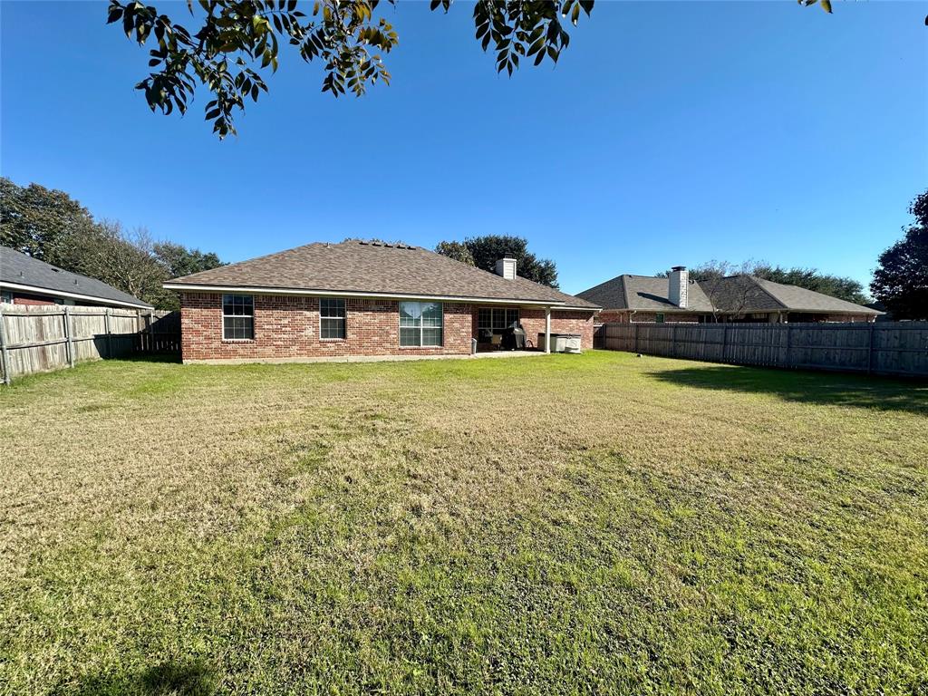 10504 Whitney Trace Drive Waco, TX 76708 - Photo 33 of 36 a view of a house with a garden