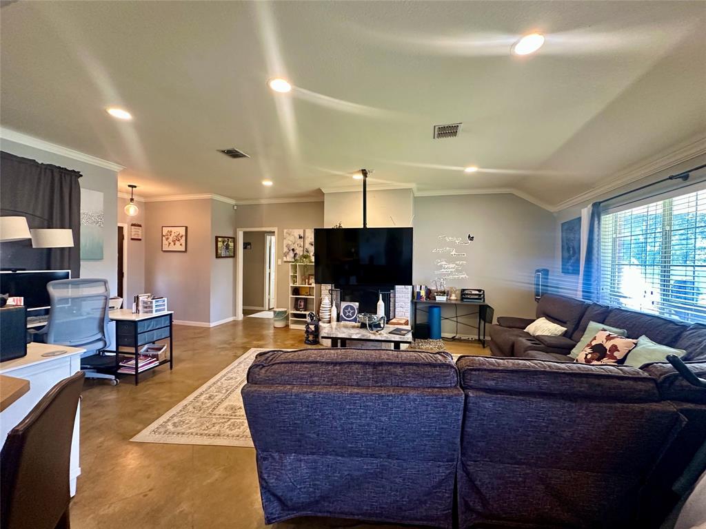 10504 Whitney Trace Drive Waco, TX 76708 - Photo 5 of 36 a living room with furniture and a flat screen tv