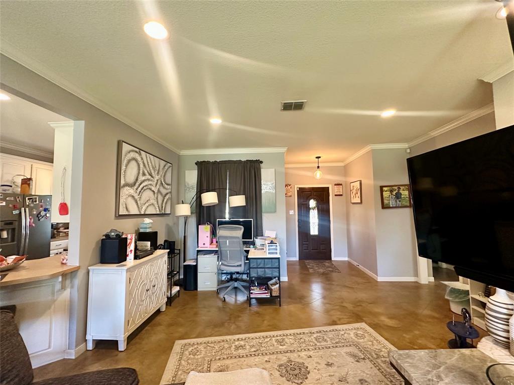 10504 Whitney Trace Drive Waco, TX 76708 - Photo 7 of 36 a living room with furniture and a flat screen tv