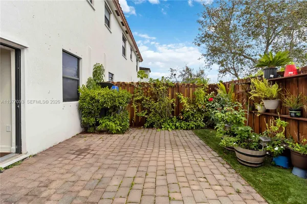 a view of a backyard of the house