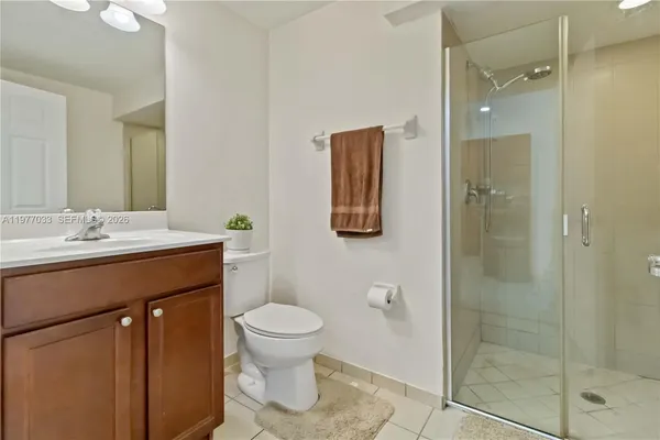 a spacious bathroom with a sink toilet and shower