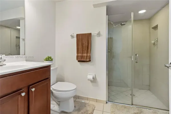 a bathroom with a toilet sink and shower
