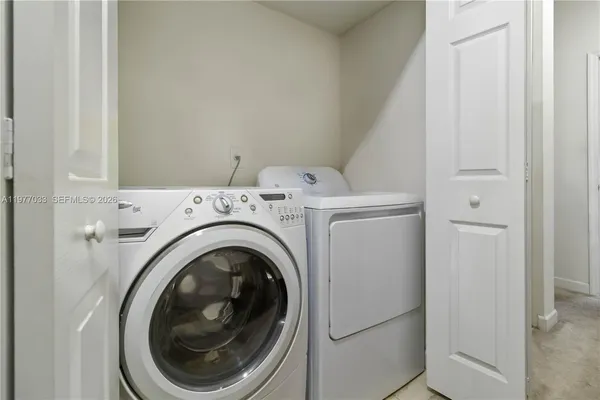 a utility room with dryer and washer