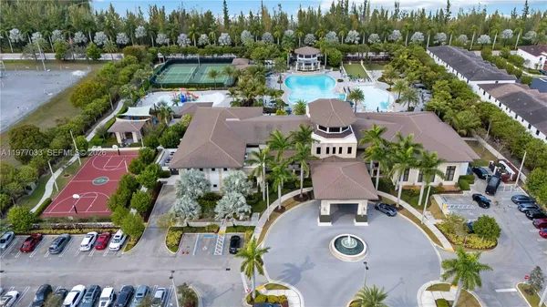 an aerial view of a house with yard swimming pool and outdoor seating