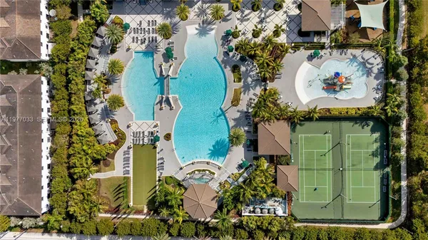 an aerial view of a residential houses with outdoor space