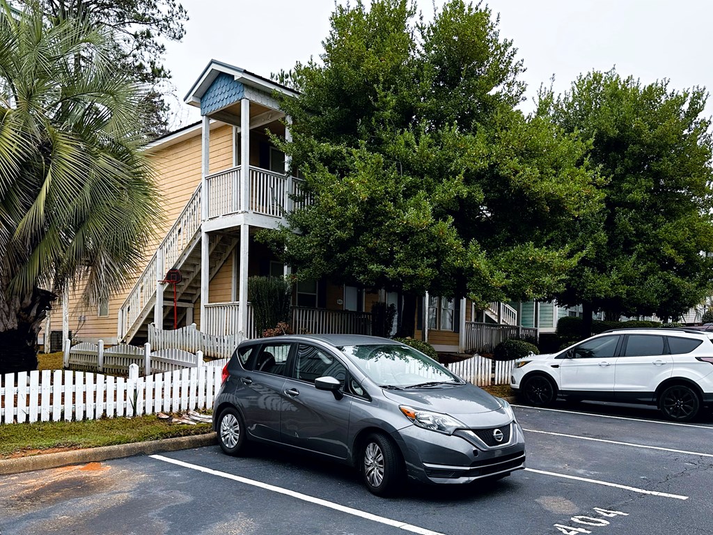 8082 Veterans Parkway, Unit 5 Columbus, GA 31909 - Photo 3 of 7 a view of a car parked in front of a house