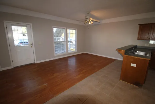 a view of a livingroom with furniture and wooden floor