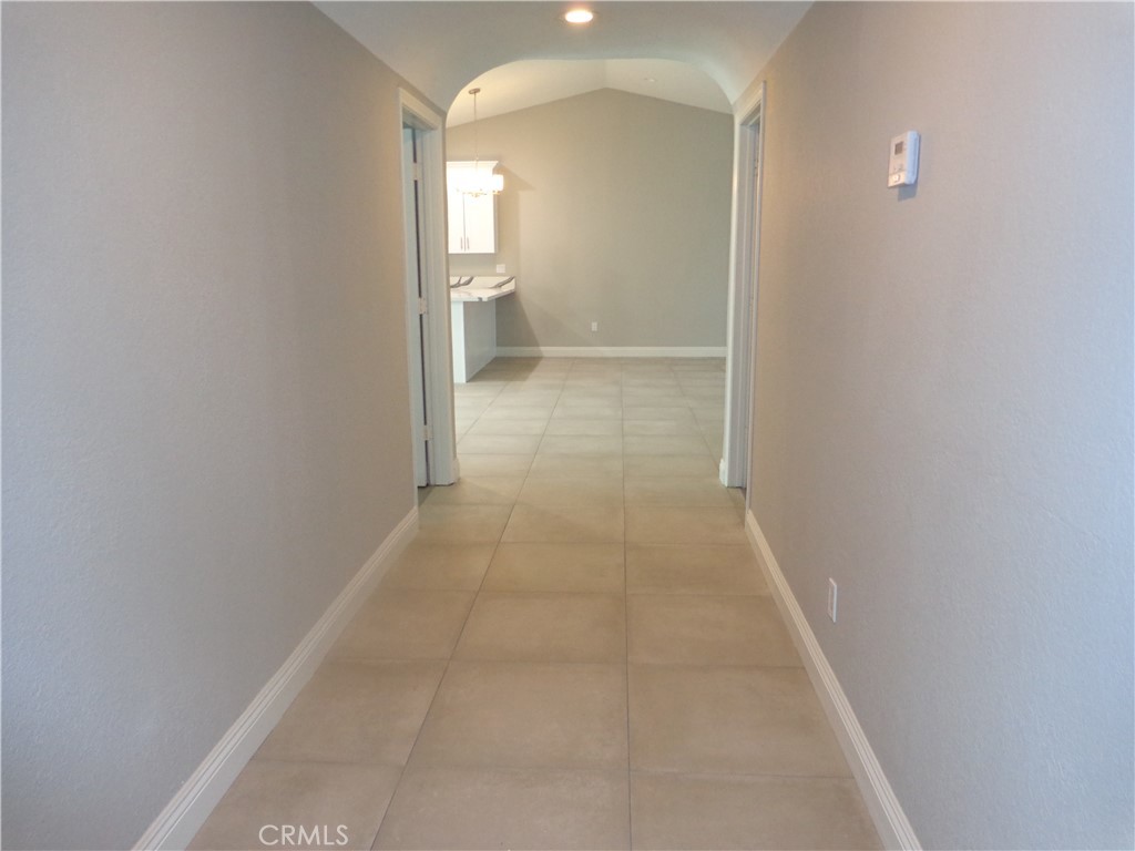 12744 Running Deer Road Apple Valley, CA 92308 - Photo 12 of 30 a view of a room with an empty space and window