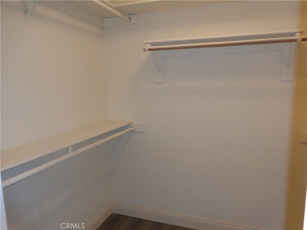 12744 Running Deer Road Apple Valley, CA 92308 - Photo 15 of 30 a view of a room with racks on the wall