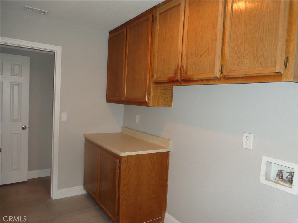 12744 Running Deer Road Apple Valley, CA 92308 - Photo 23 of 30 a utility room with dryer and washer