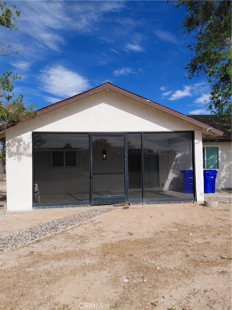 12744 Running Deer Road Apple Valley, CA 92308 - Photo 30 of 30 a house with a outdoor space