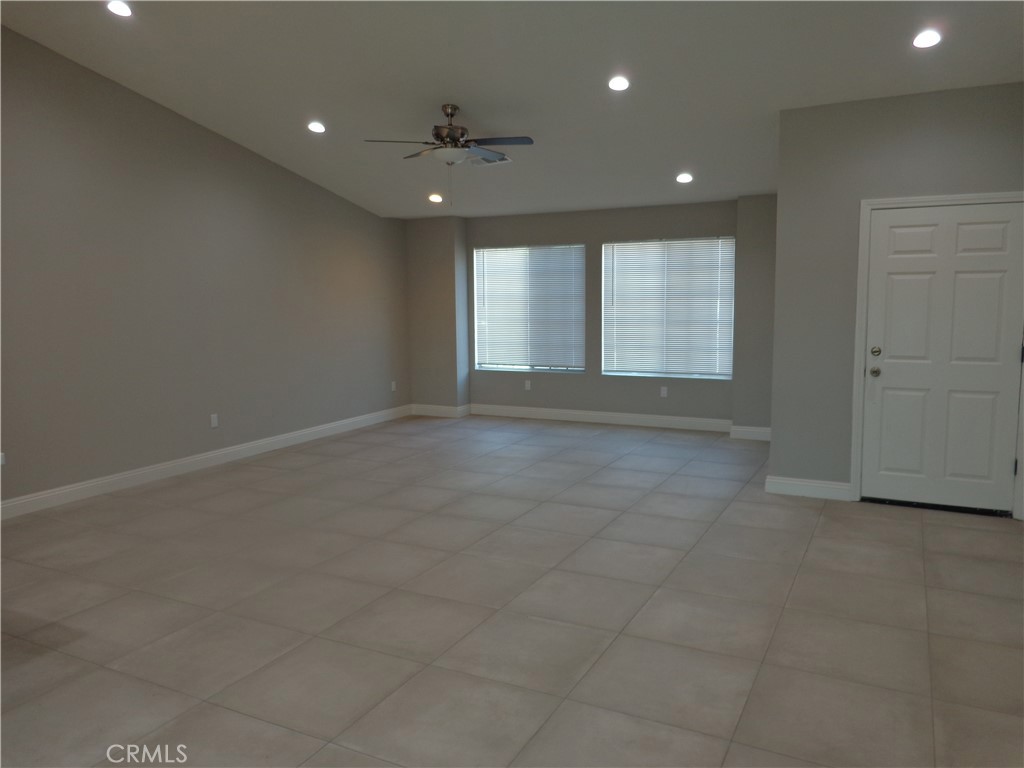 12744 Running Deer Road Apple Valley, CA 92308 - Photo 3 of 30 a view of an empty room with a window