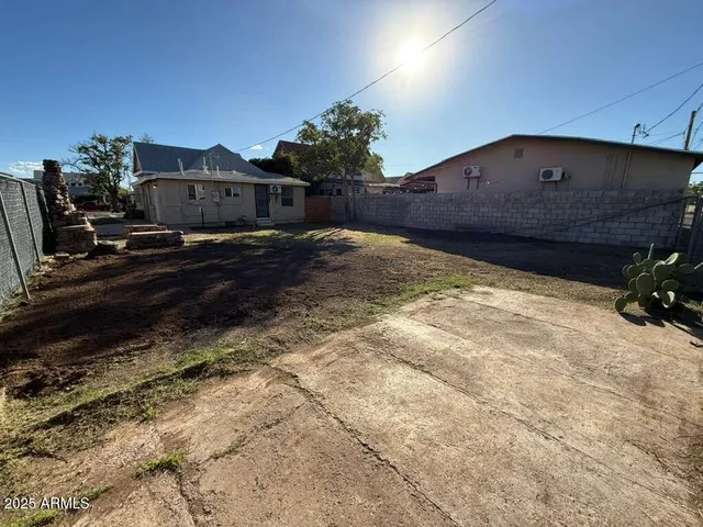 a view of a car park in front of a house