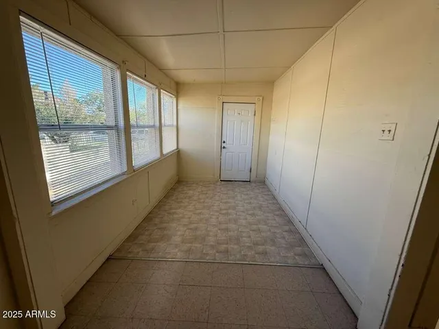 a view of hallway with a large window