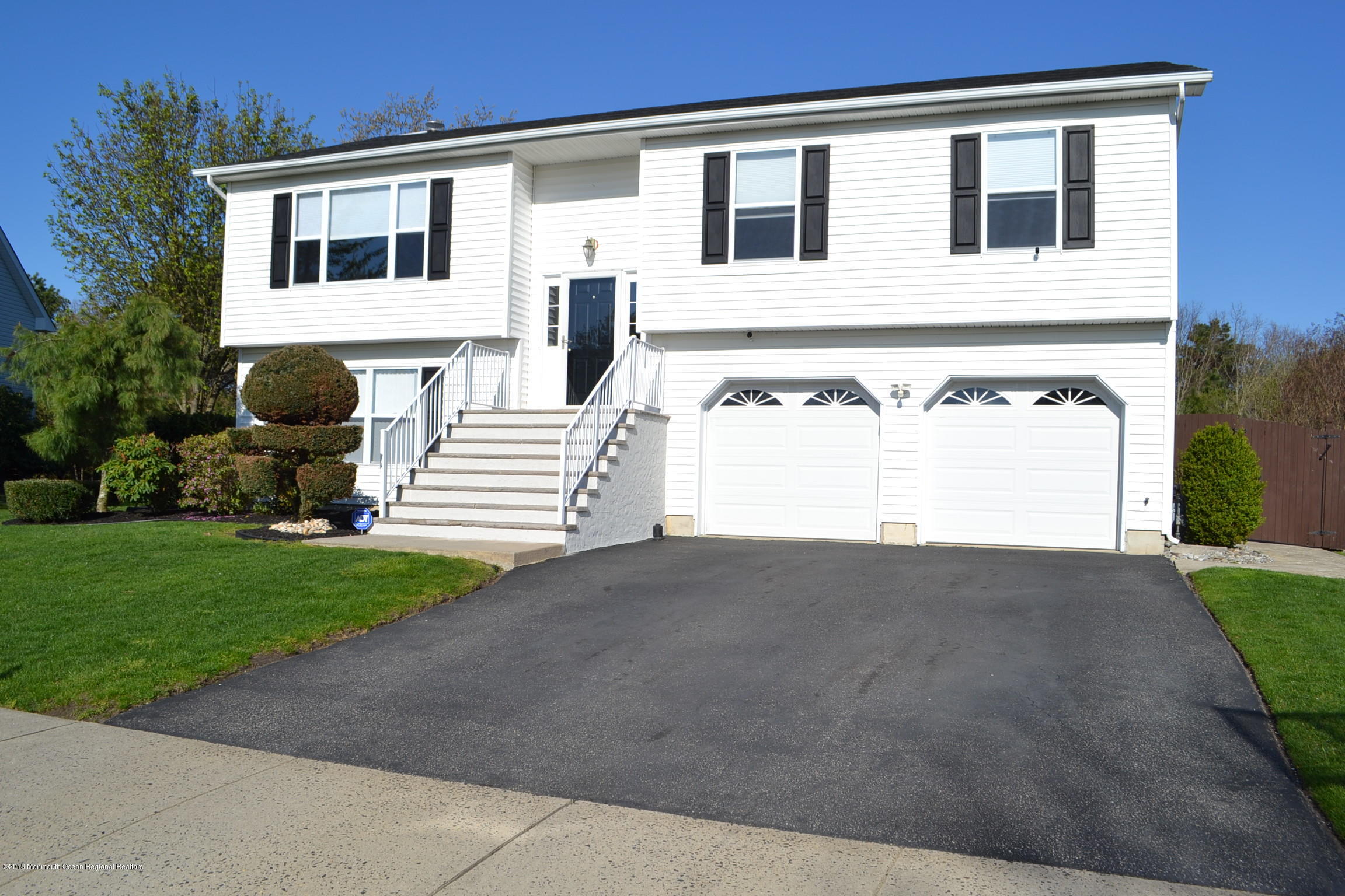 30 Netty Street Howell, NJ 07731 - Photo 1 of 24 a front view of a house with a yard and garage