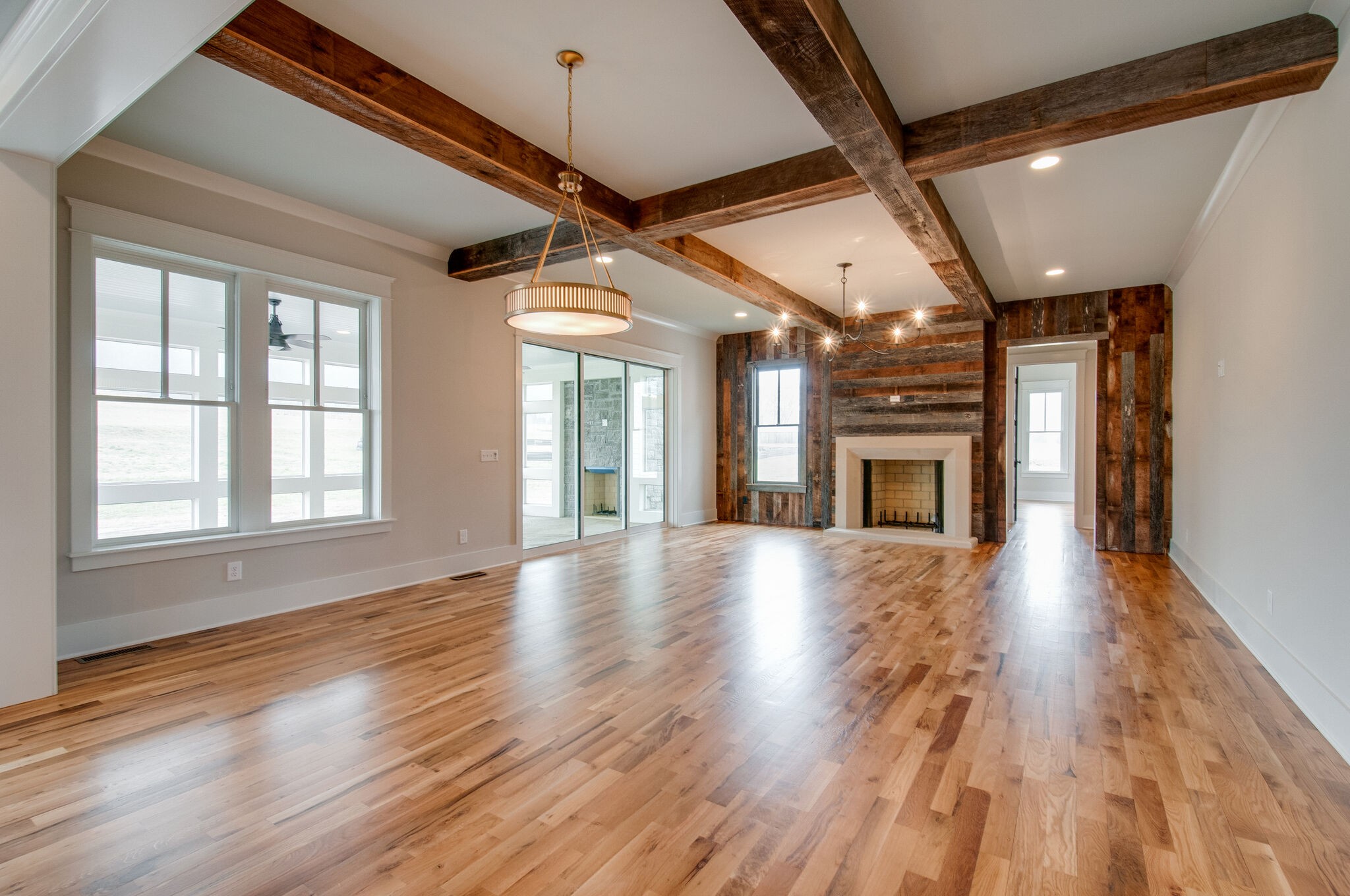 4510 Harpeth School Road Franklin, TN 37064 - Photo 12 of 43 a view of an empty room with wooden floor fireplace and a window