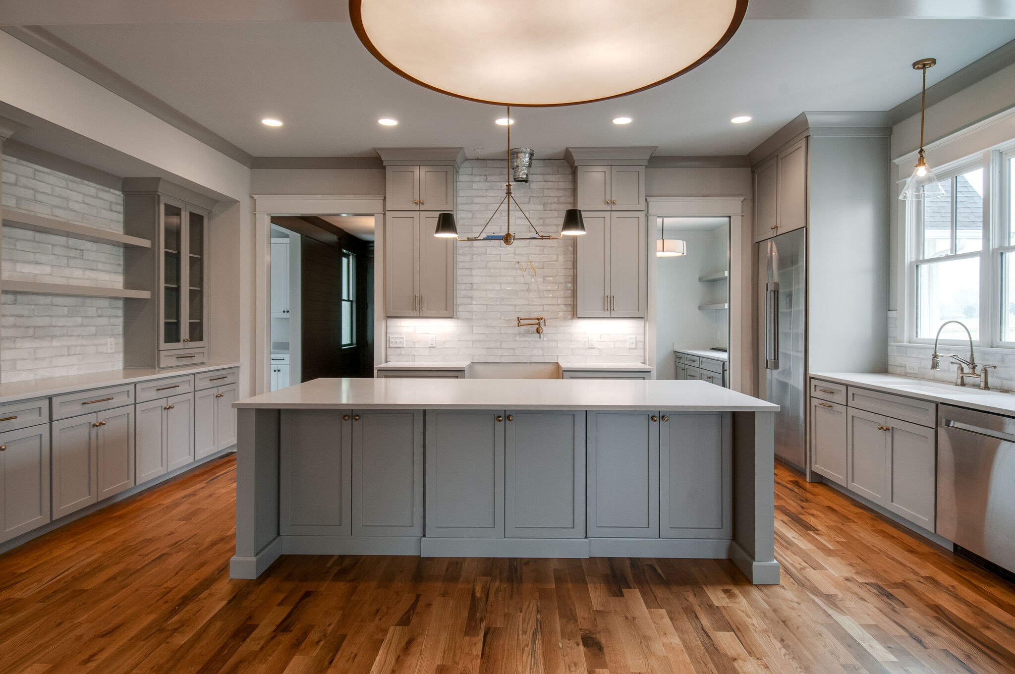 4510 Harpeth School Road Franklin, TN 37064 - Photo 16 of 43 a large kitchen with stainless steel appliances kitchen island granite countertop a large cabinets a sink and wooden floor