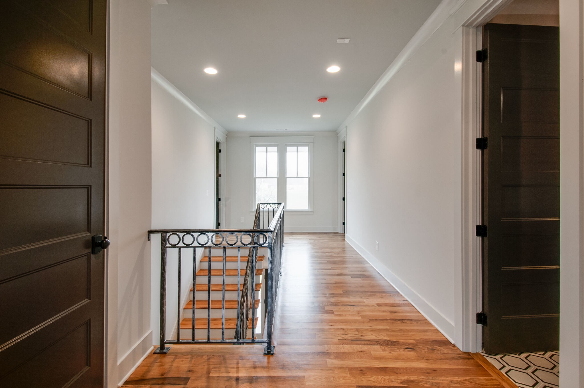 4510 Harpeth School Road Franklin, TN 37064 - Photo 34 of 43 a view of hallway with stairs and wooden floor
