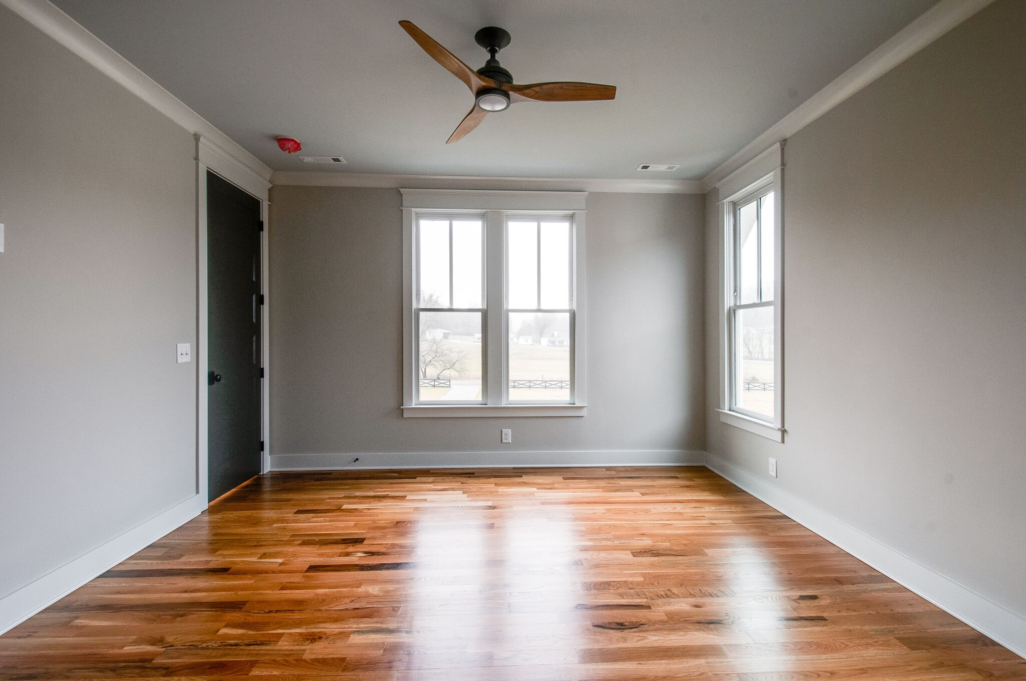 4510 Harpeth School Road Franklin, TN 37064 - Photo 35 of 43 an empty room with wooden floor and windows