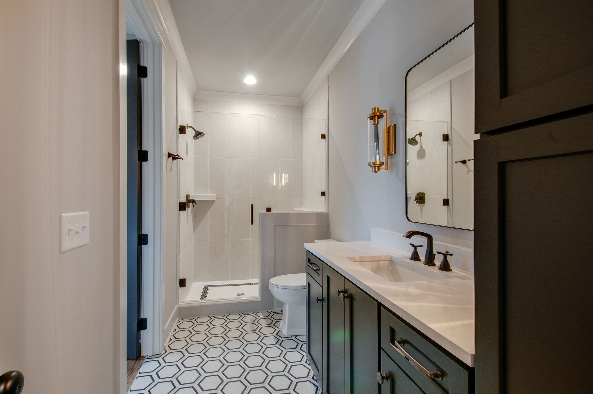 4510 Harpeth School Road Franklin, TN 37064 - Photo 36 of 43 a bathroom with a granite countertop sink a mirror and a shower