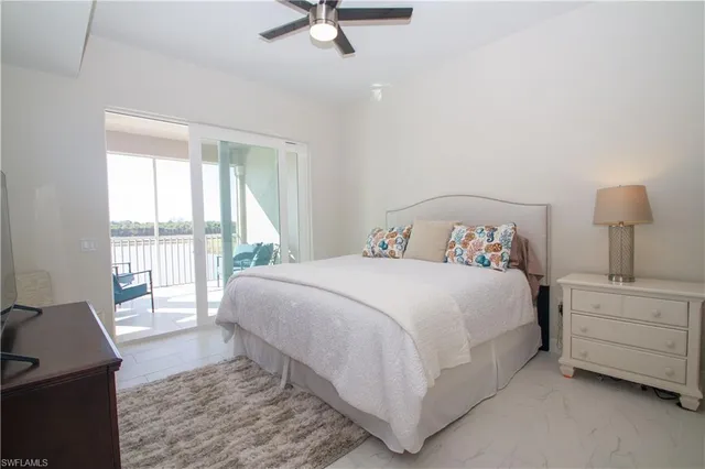 a bedroom with a bed and a night stand