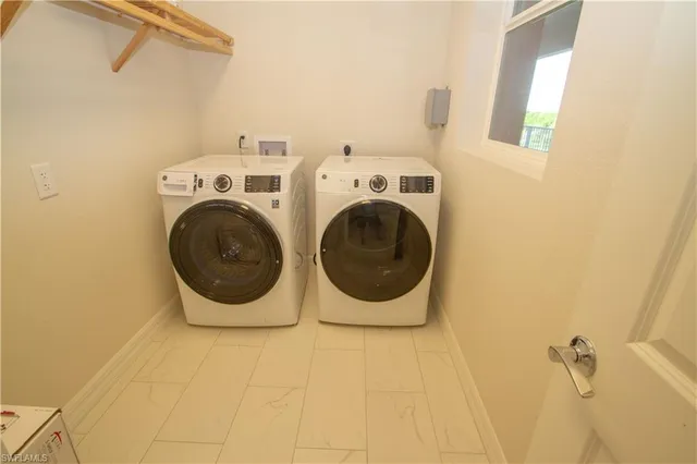 a utility room with dryer and washer