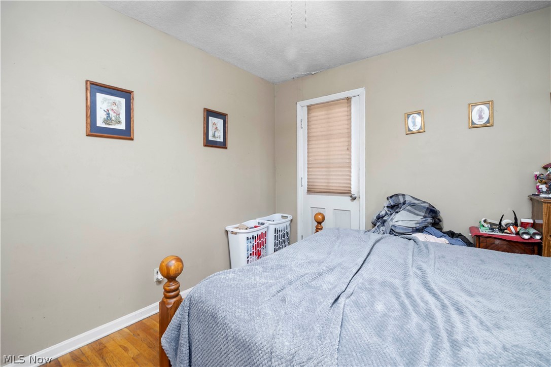 3305 Warren Road Cleveland, OH 44111 - Photo 24 of 28 Bedroom featuring light hardwood / wood-style flooring