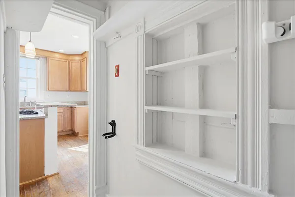 a bathroom with a toilet a sink a mirror a bathtub and shower